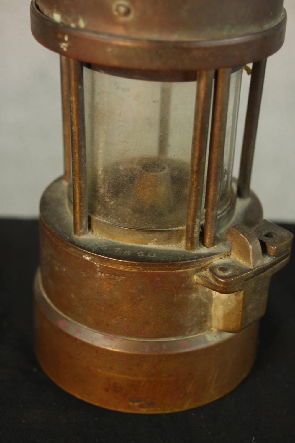 An early 20th century copper Type 1A miners lamp, with swing handle and embossed plaque to the - Image 4 of 5