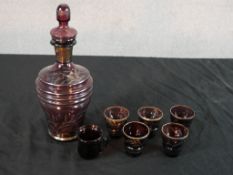 A mid 20th century amethyst glass and silver overlaid liqueor set with decanter and glasses with