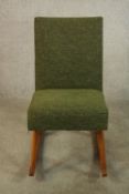 A mid 20th century Ercol style teak framed low rocking chair upholstered in green fabric. H.77 W.