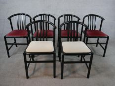 A set of six circa 1990s ebonised ash dining chairs, with curved backs, four upholstered in burgundy