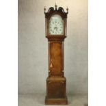 A 19th century oak cased longcase clock, with broken swan neck pediment and three brass finials