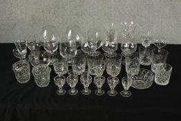 Assortment of cut crystal and other drinking glasses to include wine glasses and tumblers. H.18.5