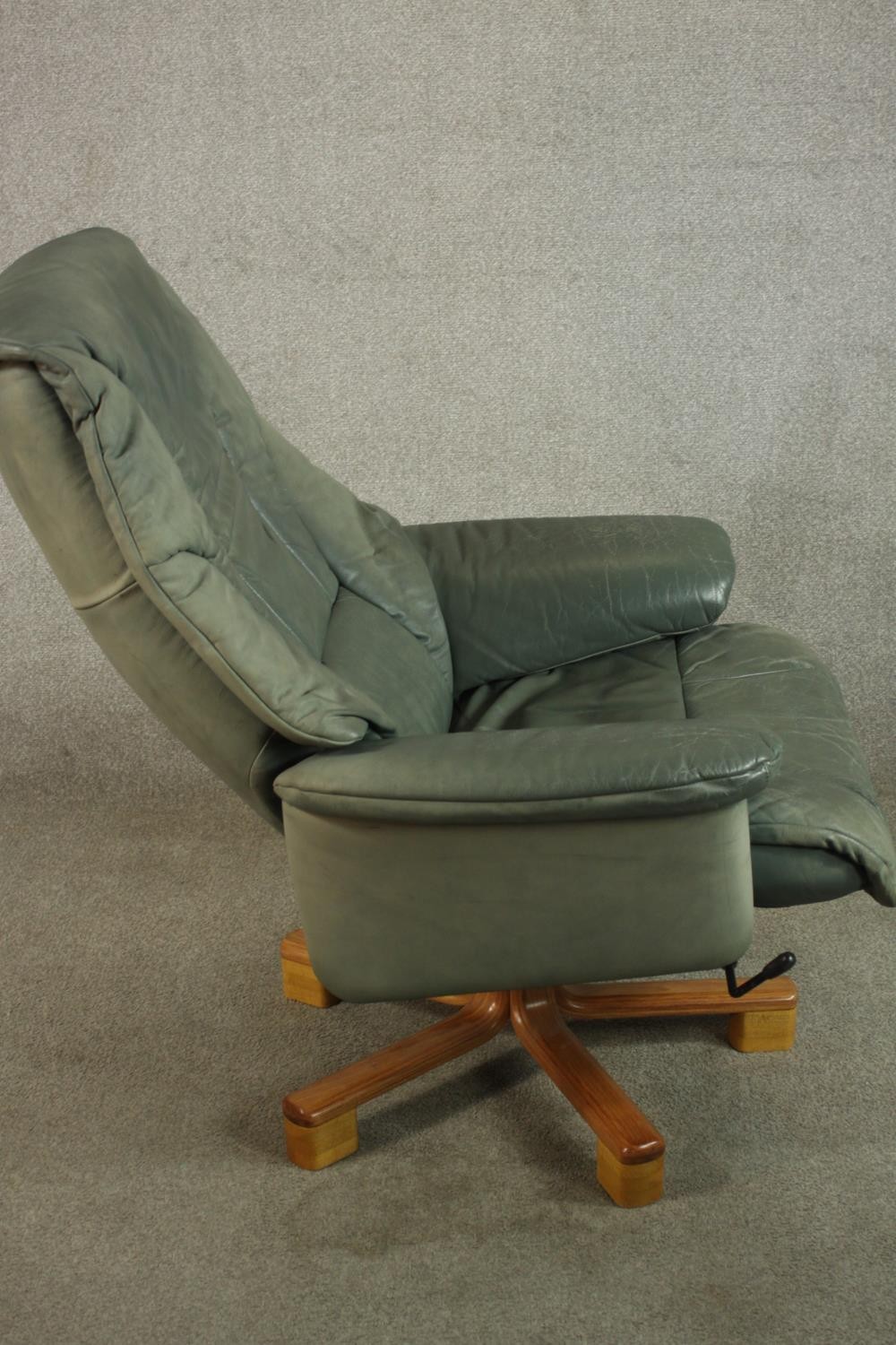 A 20th century pale green leather swival and counter leaver arm chair raised on five splayed - Image 4 of 8