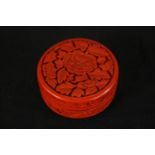 A late 19th/early 20th century Chinese red cinnabar lacquer cylindrical box and cover, carved with