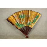 A large 20th century Chinese paper fan decorated with waterlillies. H.89 W.140cm.