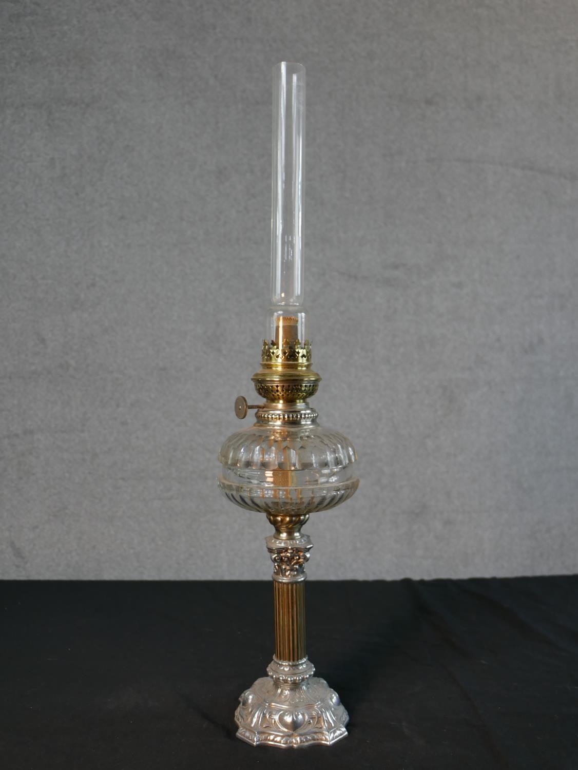 Three Victorian brass oil lamps, one with a spherical etched glass shade and a glass funnel, on an - Image 16 of 16