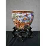 A contemporary Chinese porcelain jardinere/fish bowl, decorated with figures in a walled garden with
