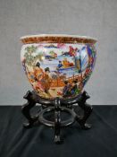 A contemporary Chinese porcelain jardinere/fish bowl, decorated with figures in a walled garden with