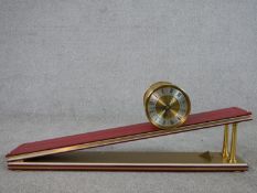 A 20th century Dent of London limited edition novelty inclined plane clock, the gilt metal barrel