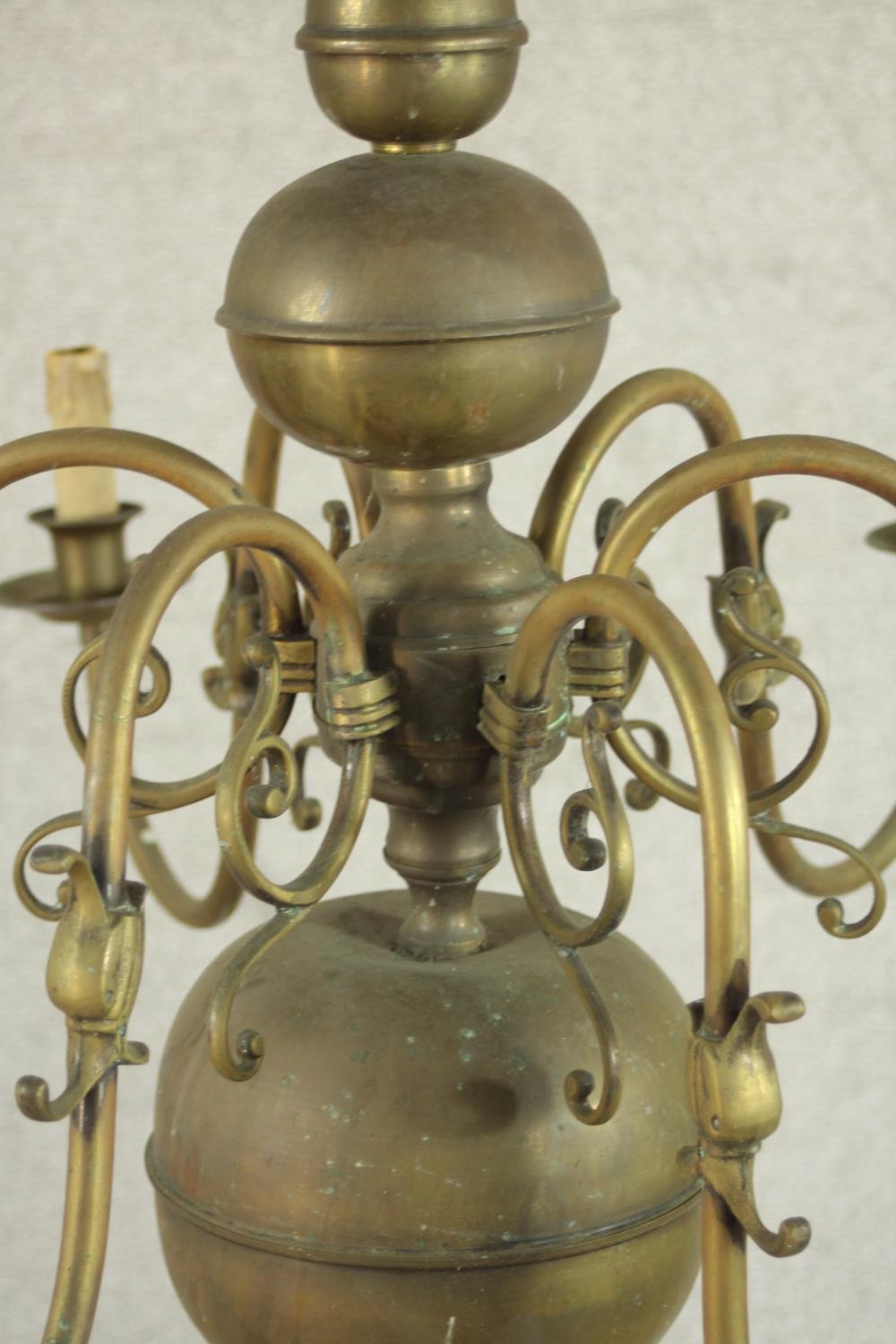 A 20th century Dutch style six branch brass chandelier with scroll arms. Damaged. H.70 Dia.42cm. - Image 5 of 8