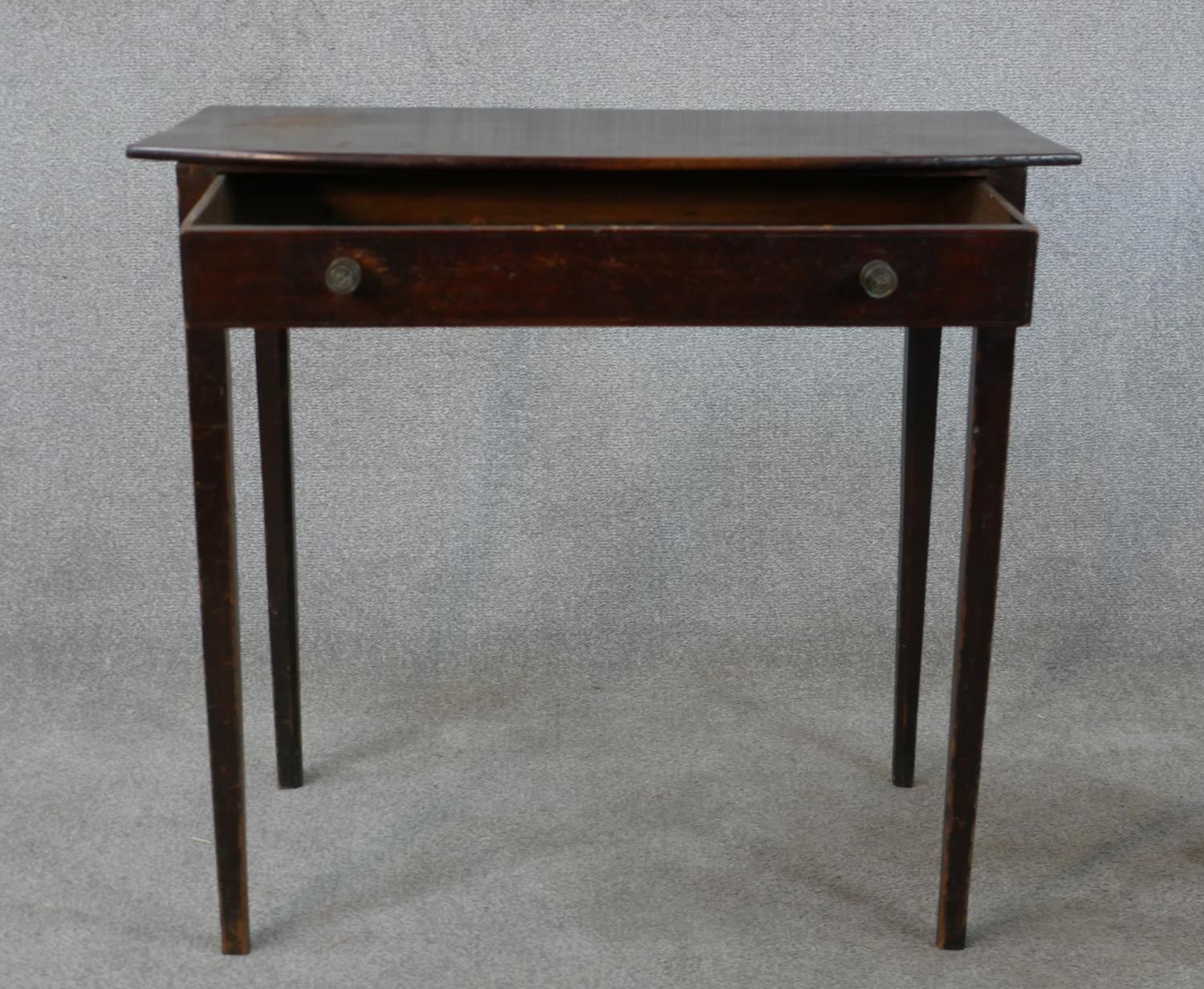 An 18th century mahogany bow fronted side table, with single long drawer on square tapering legs. - Image 3 of 5