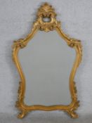 A 20th century, probably Italian gilt painted cartouche shaped wall mirror. H.109 D.64cm