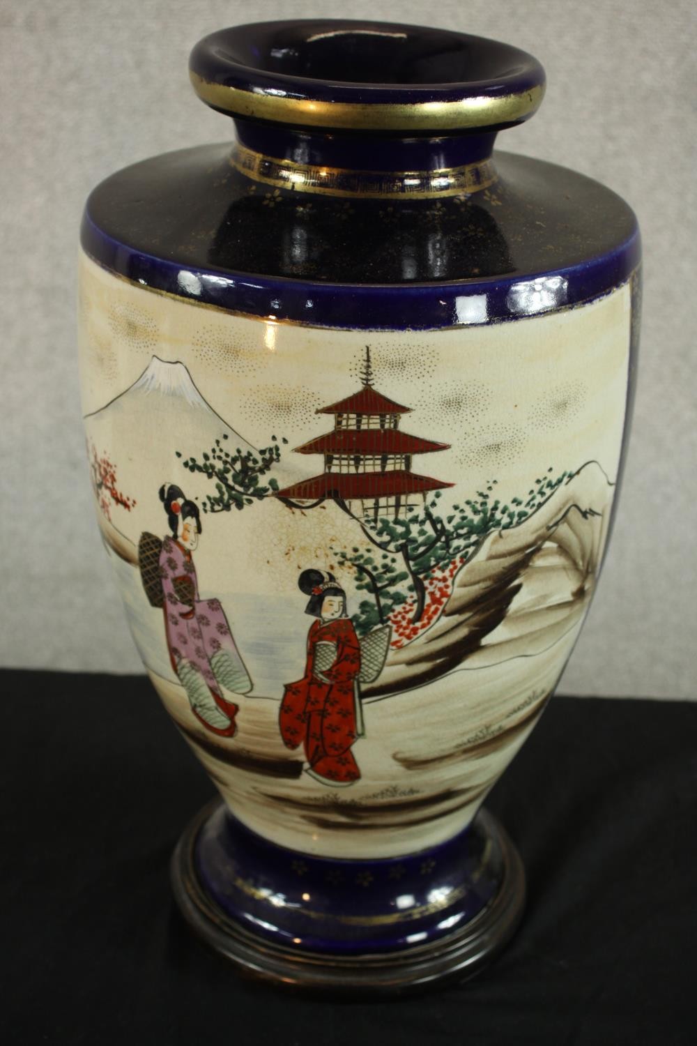 A mid Japanese Satsuma pottery vase, decorated with figures in a temple with Mount Fuji behind, - Image 5 of 6