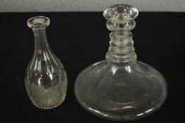 A 19th century clear glass triple ring ships decanter and stopper together with a faceted glass