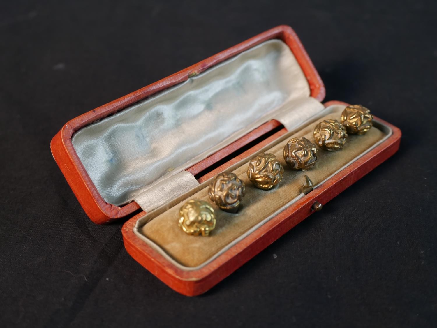 A leather cased set of six 19th century Chinese gilt metal carved floral design robe buttons, one - Image 2 of 3