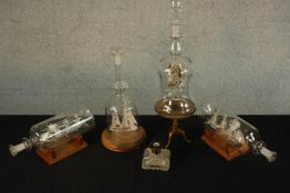 Three 20th century glass ships in a bottle, each on a stand, together with glass and gilt ornament