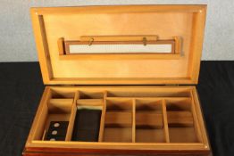 A 20th century mahogany and ceder lined humidor complete with associated cigar cutters. H.8 W.45 D.