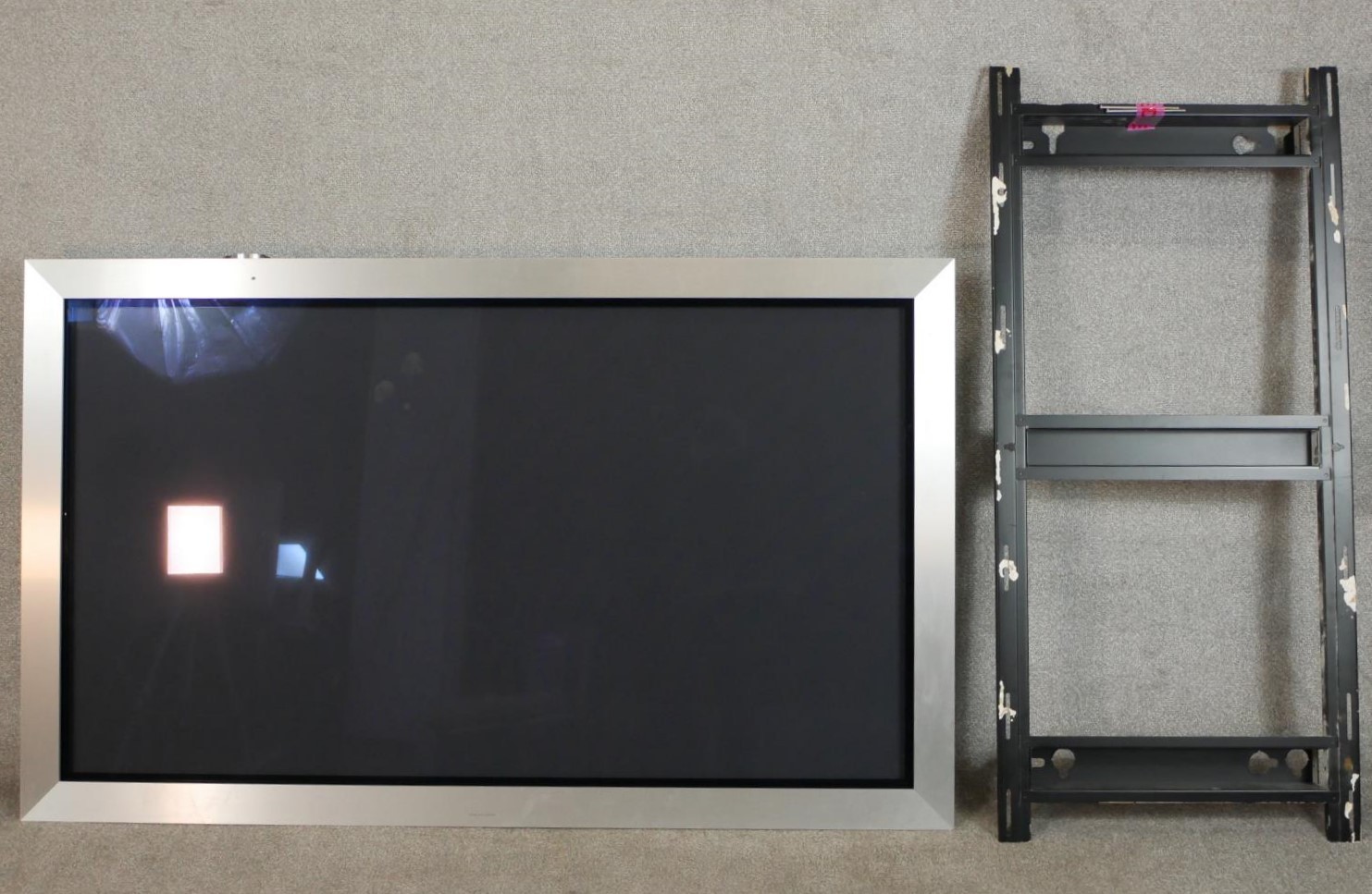 A Bang & Olufsen Beovision 4-50 colour television with wall bracket.