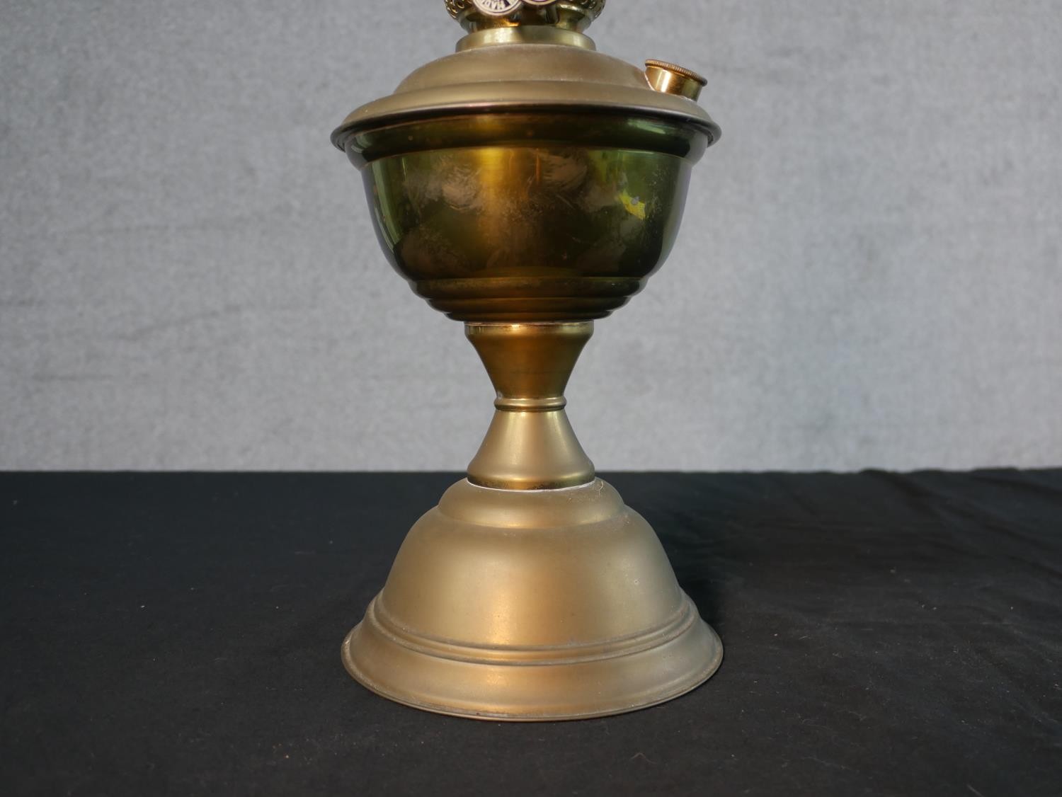 Three Victorian brass oil lamps, one with a spherical etched glass shade and a glass funnel, on an - Image 11 of 16