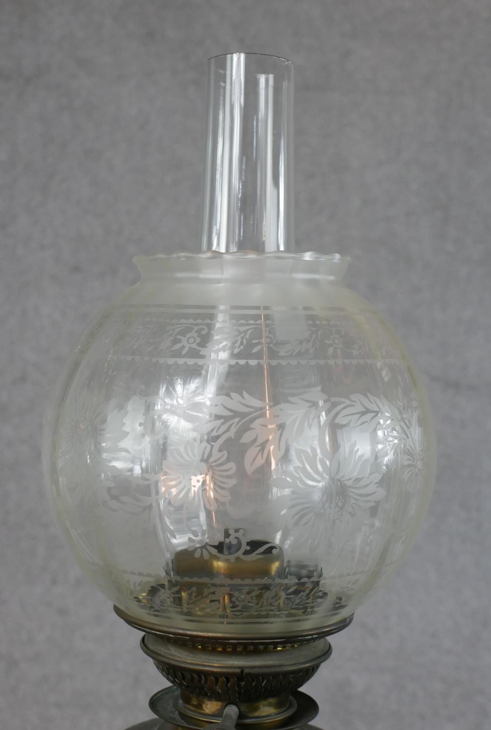 Three Victorian brass oil lamps, one with a spherical etched glass shade and a glass funnel, on an - Image 3 of 16