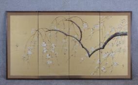 A 20th century Chinese three fold four panel silk screen decorated with blossom. H.91 W.168cm