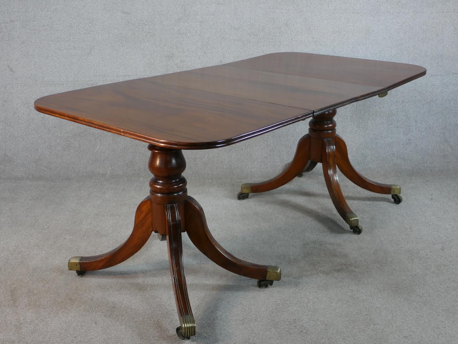A Regency mahogany wind out extending D-end dining table, with additional leaf, raised on turned - Image 5 of 5