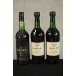 Two bottles of 1963 Grahams Vintage Port together with a bottle 1991 Croft Port. H.30 Dia.8.5cm. (