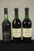 Two bottles of 1963 Grahams Vintage Port together with a bottle 1991 Croft Port. H.30 Dia.8.5cm. (