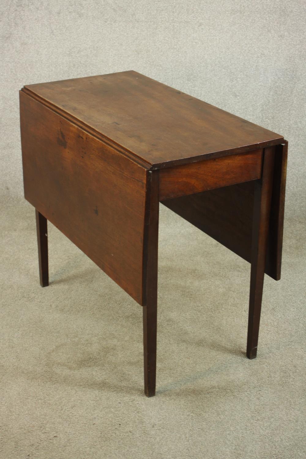 A George III mahogany drop leaf gate leg table, raised on square tapering supports. H.72 W.120 D. - Image 3 of 6