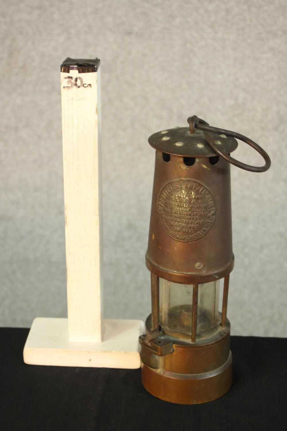 An early 20th century copper Type 1A miners lamp, with swing handle and embossed plaque to the - Image 2 of 5
