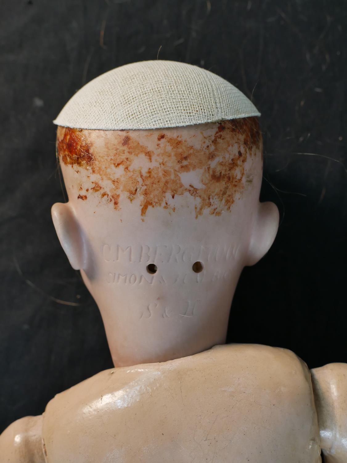 An early 20th century C. M. Bergmann bique porcelain headed composition articulated doll, - Image 6 of 7