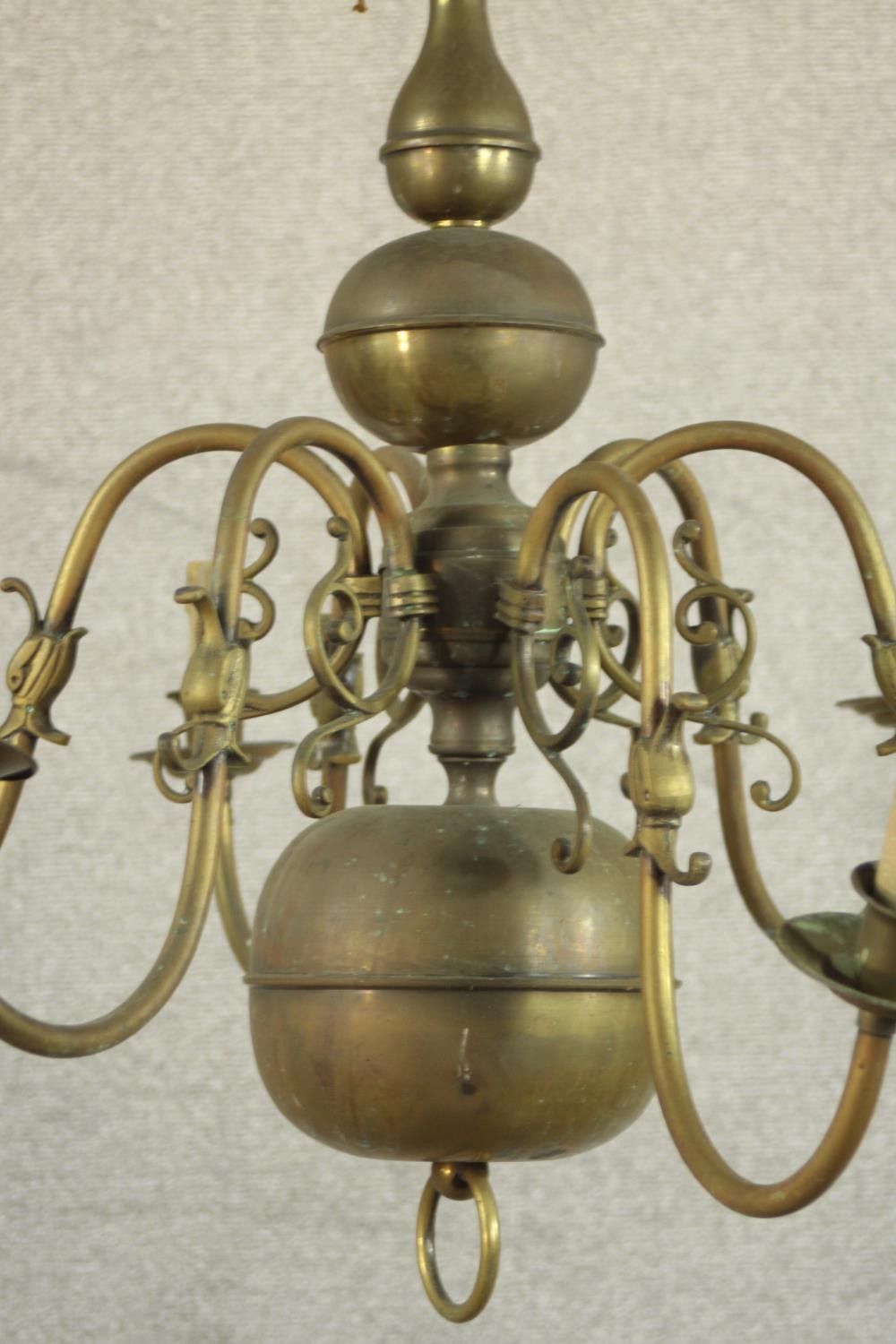 A 20th century Dutch style six branch brass chandelier with scroll arms. Damaged. H.70 Dia.42cm. - Image 8 of 8