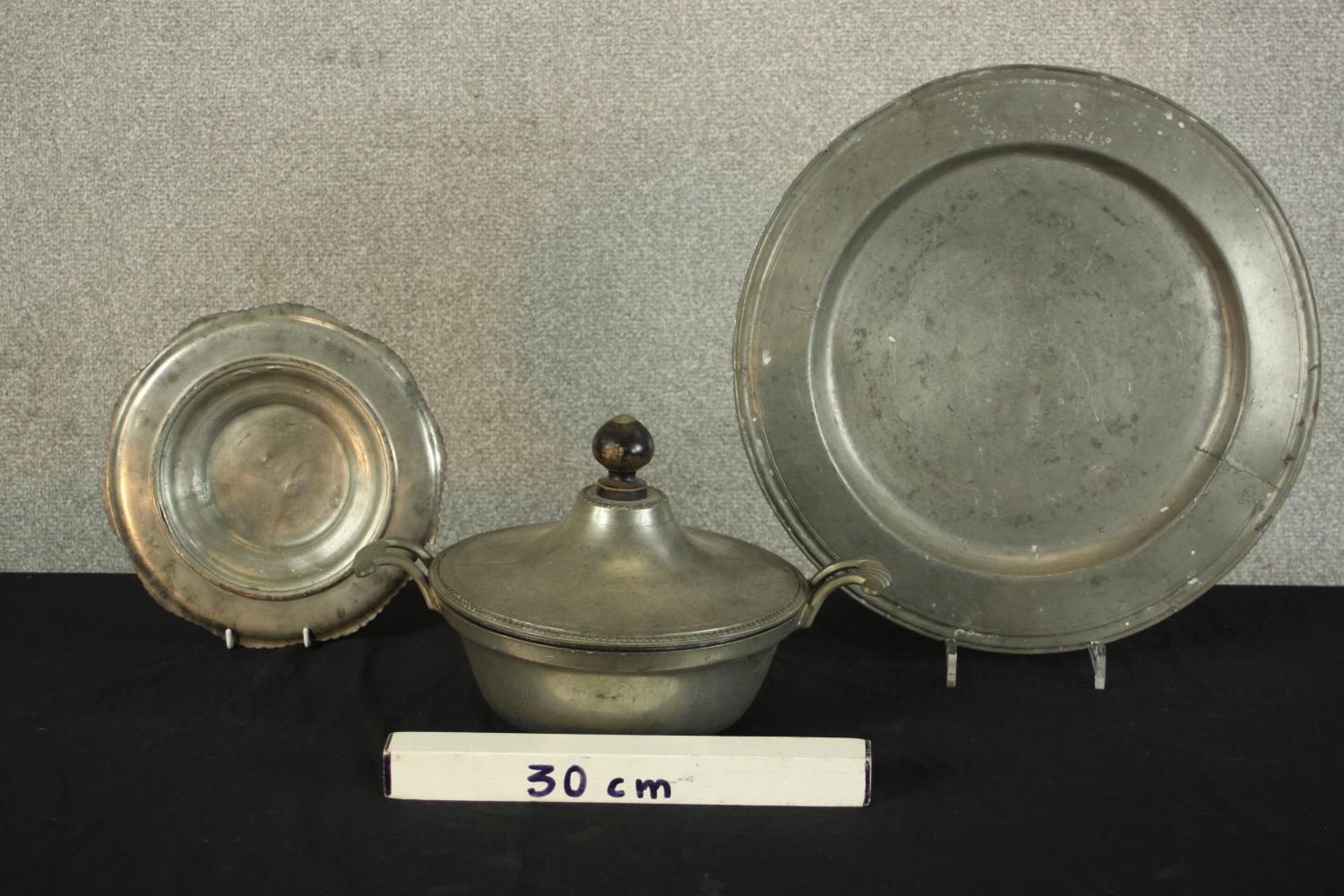 Three pieces of pewter comprising of pewter comprising of two chargers and a twin handled tureen and - Image 2 of 10