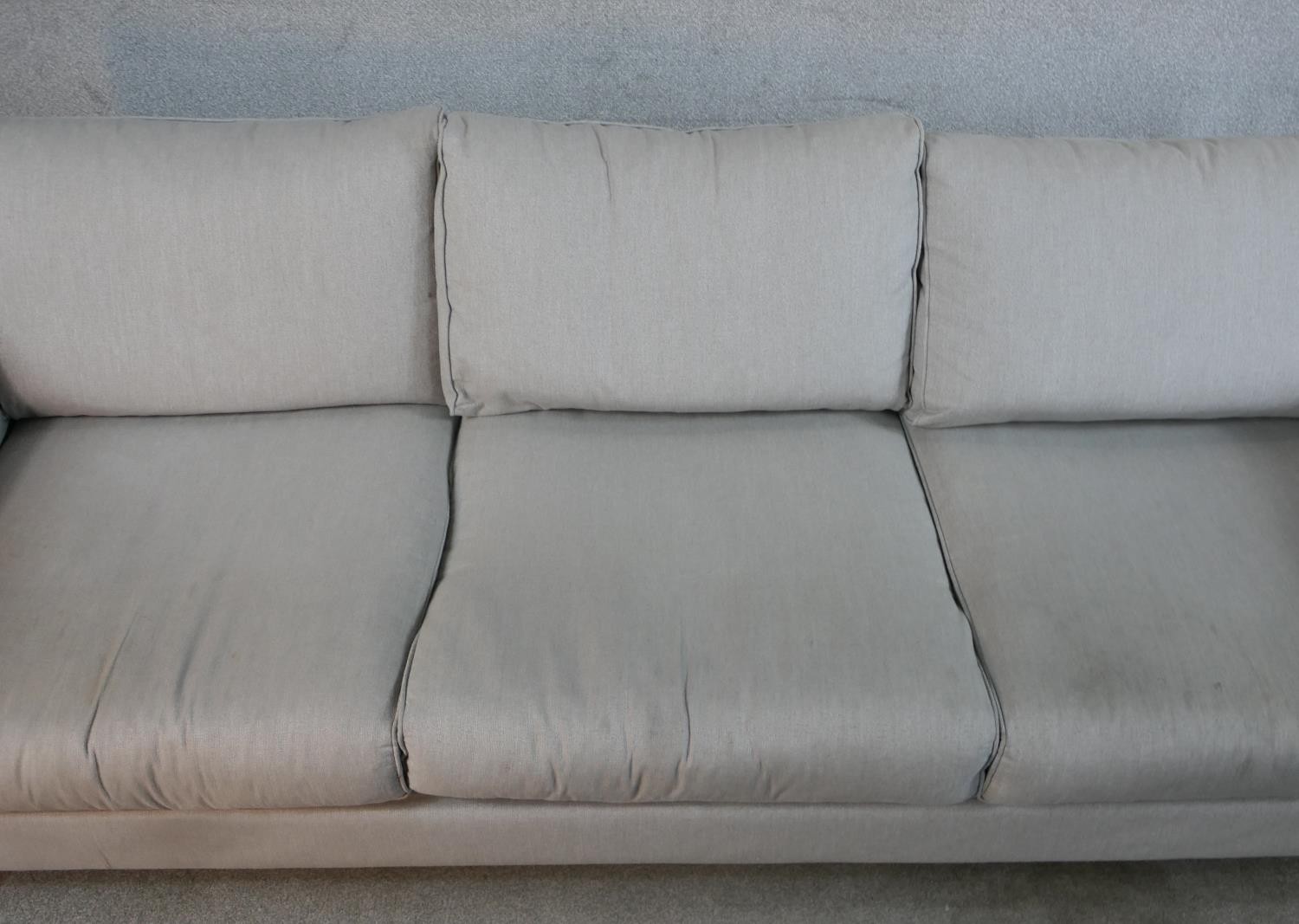 A contemporary three seater Calligaris settee, upholstered in grey fabric raised on shaped beech - Image 3 of 7
