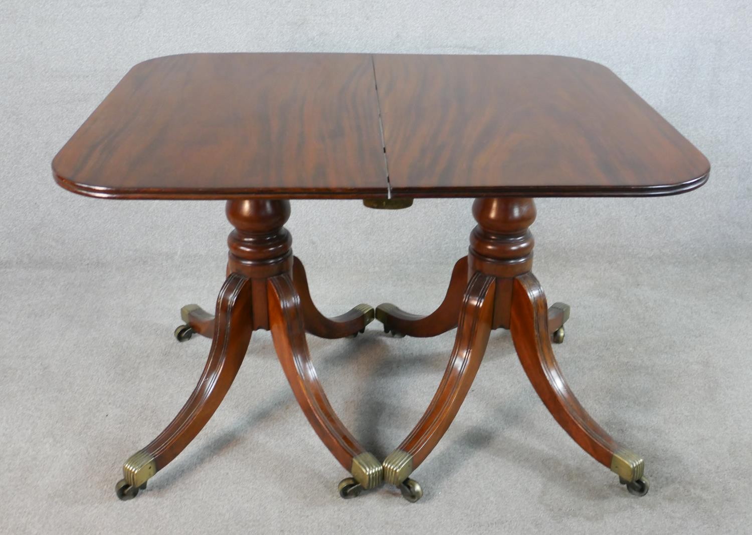 A Regency mahogany wind out extending D-end dining table, with additional leaf, raised on turned - Image 2 of 5