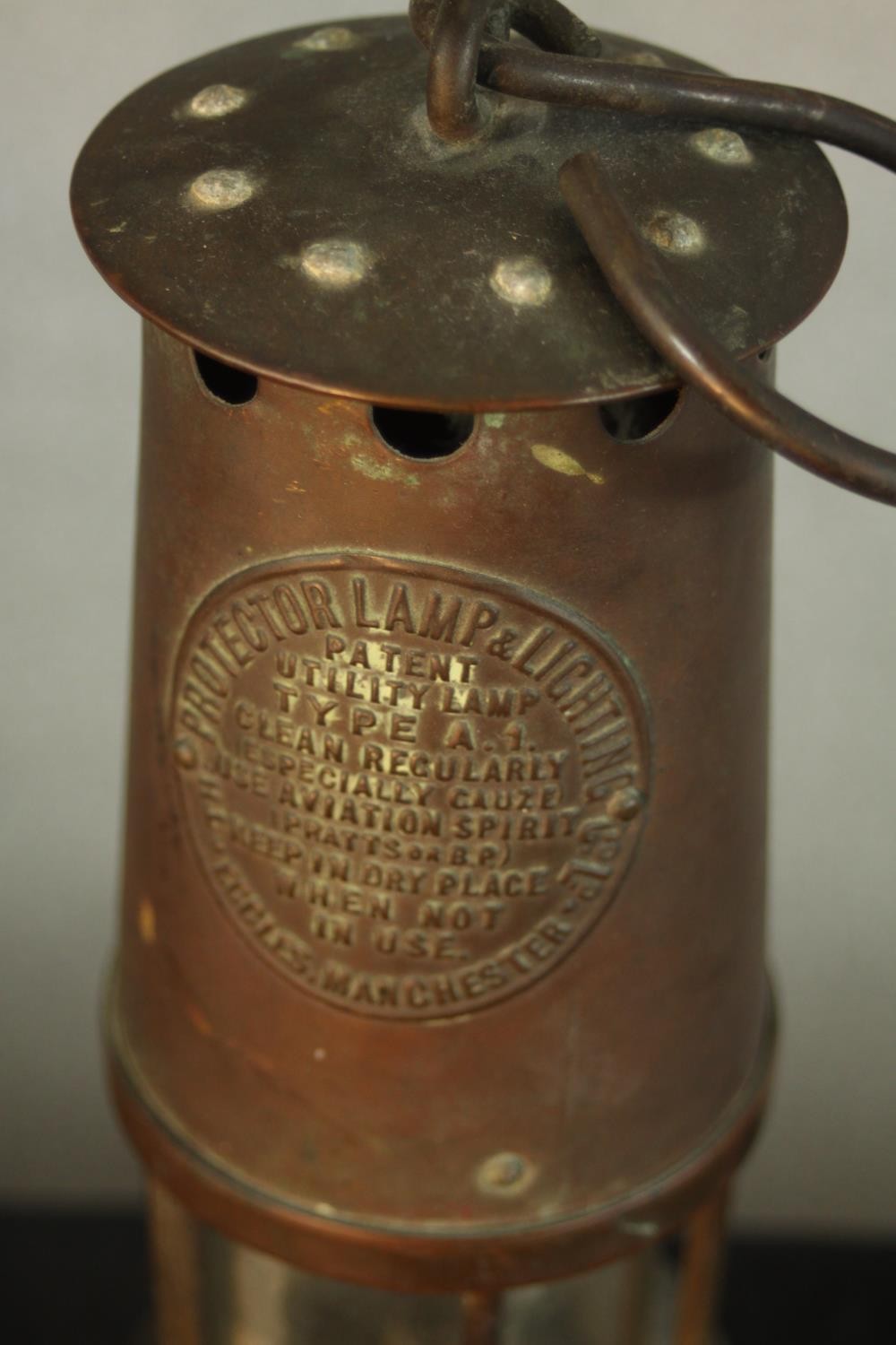 An early 20th century copper Type 1A miners lamp, with swing handle and embossed plaque to the - Image 3 of 5