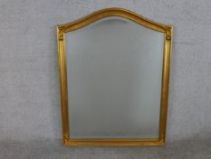 A gilt framed arch topped gilt framed wall mirror. H.90 W.70cm