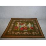 A 20th century unframed tapestry depicting an Egyptian mummy and the Sphinx within a floral