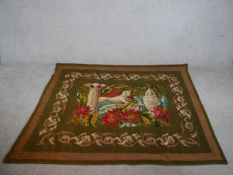 A 20th century unframed tapestry depicting an Egyptian mummy and the Sphinx within a floral