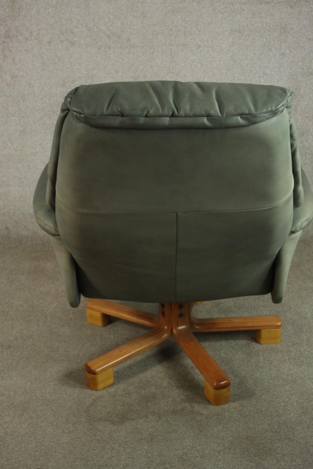 A 20th century pale green leather swival and counter leaver arm chair raised on five splayed - Image 5 of 8