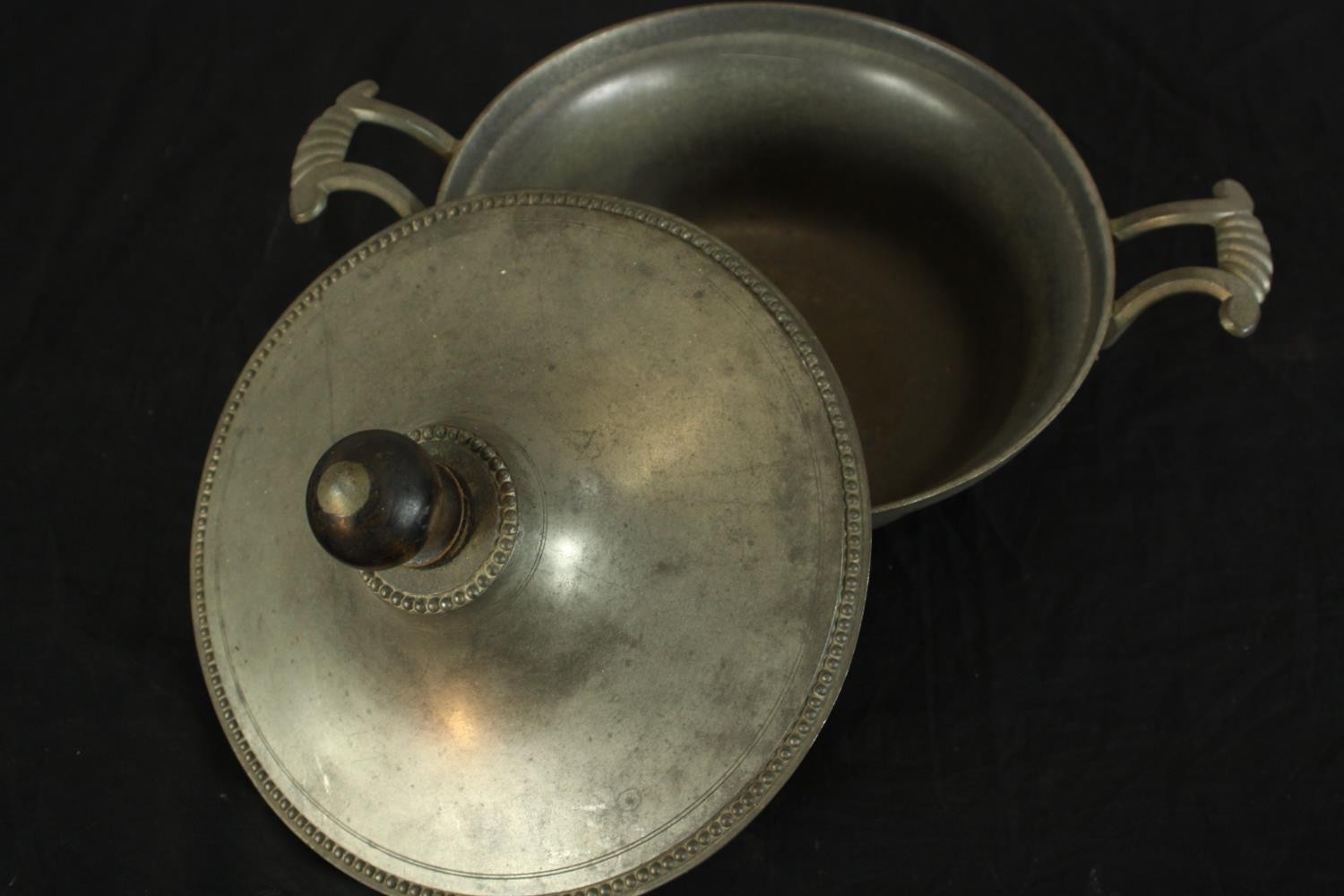 Three pieces of pewter comprising of pewter comprising of two chargers and a twin handled tureen and - Image 9 of 10