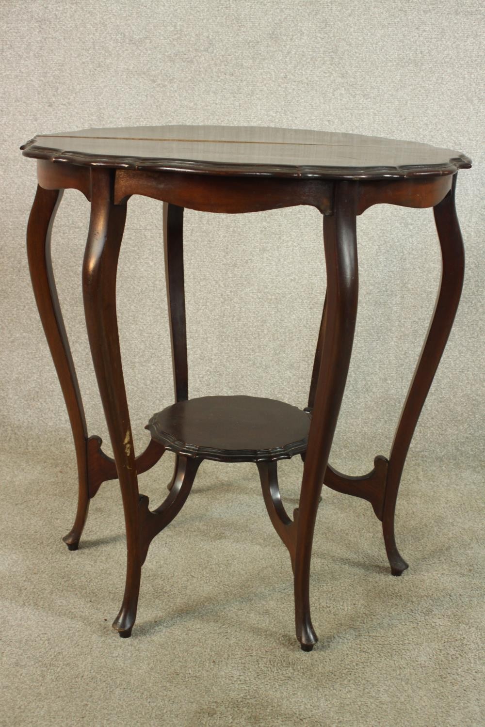 A late Victorian mahogany two tier occasional table, raised on six cabriole supports terminiating in - Image 5 of 6