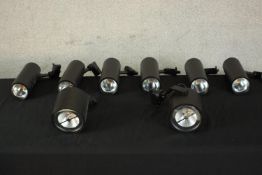 A set of six Magaman cylindrical wall mounted electric studio/picture lights, together with a pair