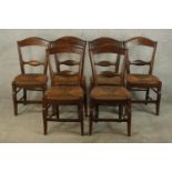 A set of six stained oak Arts & Crafts style bar dining chairs, with straw seats, raised on shaped