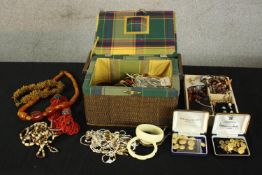 Assorted costume jewellery to include necklaces, buttons, bangles and other jewellery. H.17 W.28 D.