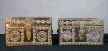 A pair of Persian style copper mounted hinge lidded boxes, each of studded design and with brass
