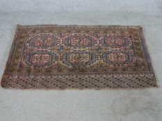 A Tekke Turkmen Juval rug woven with pink and brown fabric. L.73 W.130cm.