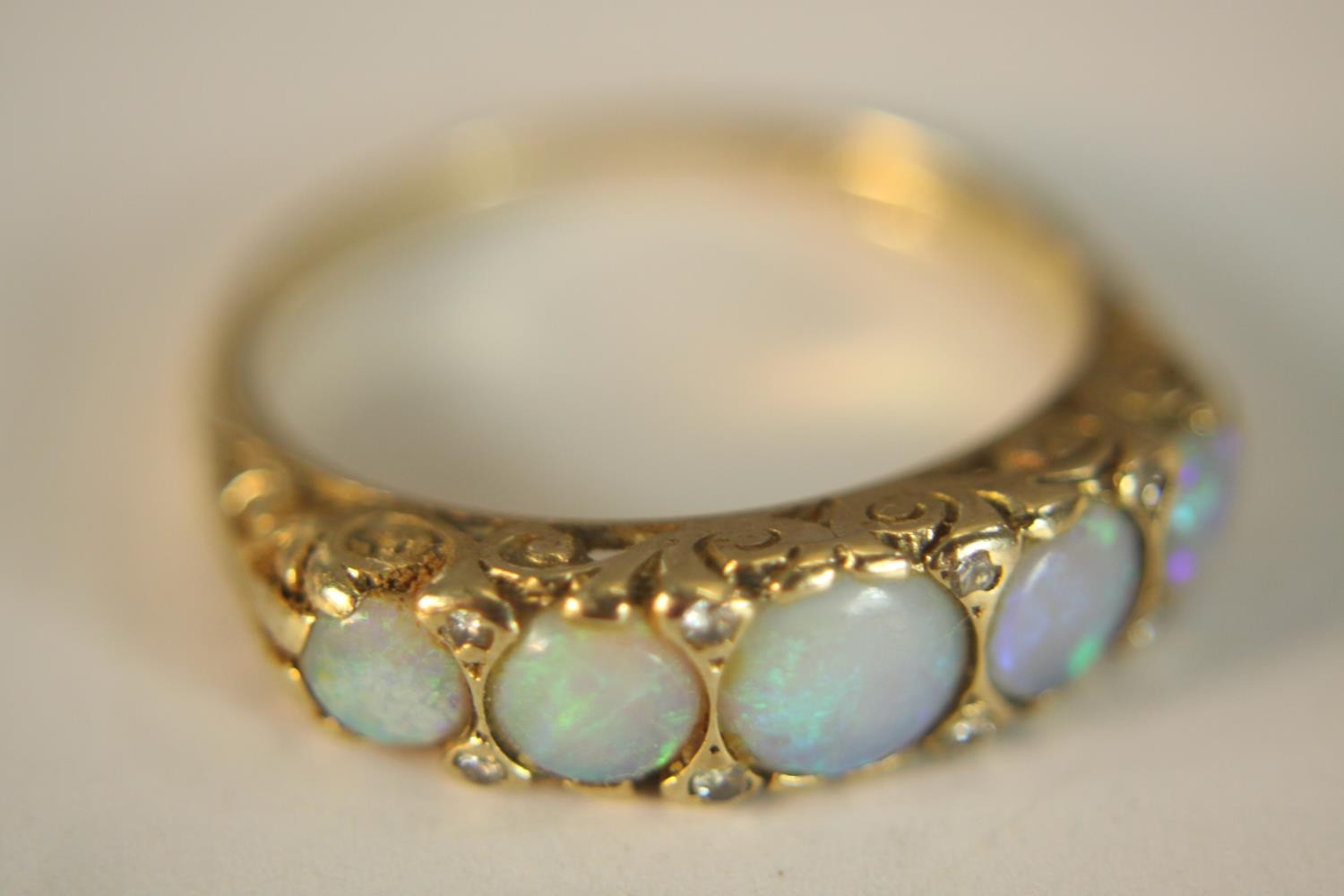 A 9ct carat yellow gold carved half hoop five stone Opal and diamond ring. Set with five round - Image 9 of 10
