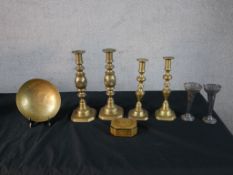 Two pairs of 19th century brass candlesticks, together with a pair of silver plated tapering