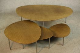 A nest of four late 20th century/contemporary Stua Eclipse oak topped occasional tables, designed